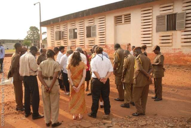 Touring a correctional facility during an outreach visit.